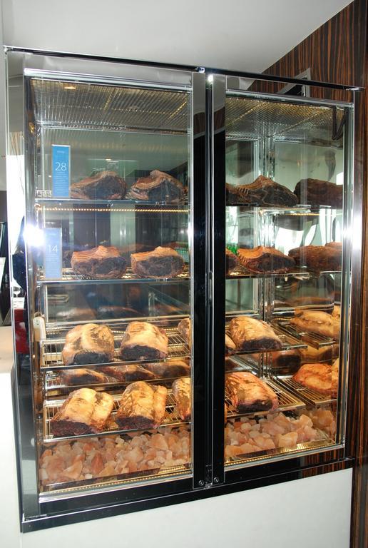 The Landis Taichung Hotel Exterior foto A display of meat maturing in a dry-aging fridge